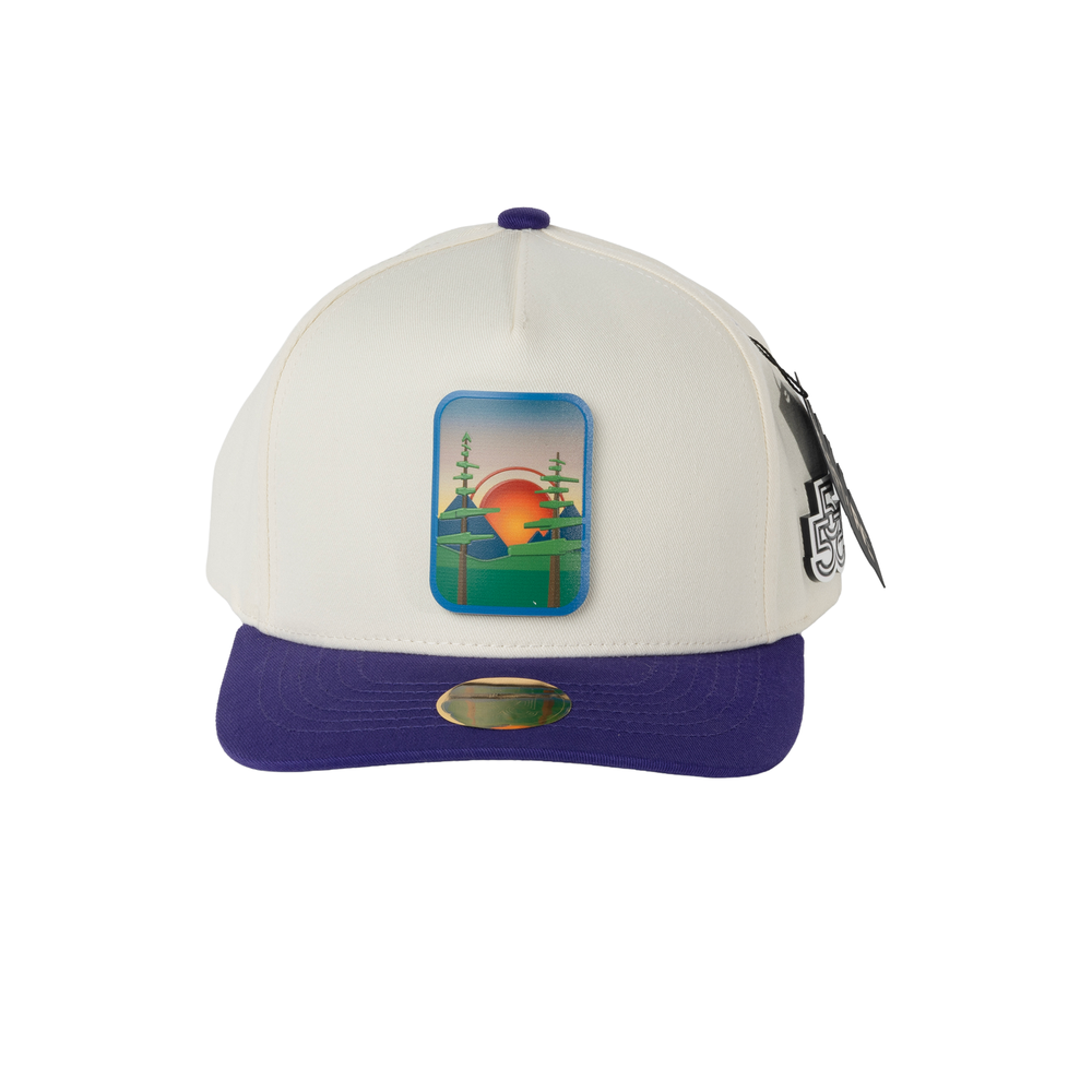 Beyond The Pines cream and purple A-frame snapback hat with forest sunset landscape badge