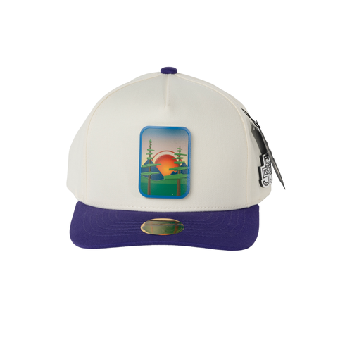 Beyond The Pines cream and purple A-frame snapback hat with forest sunset landscape badge