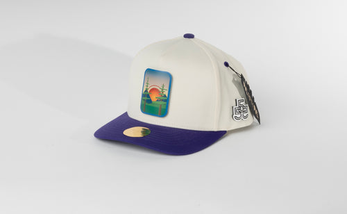 Beyond The Pines cream and purple hat angled view